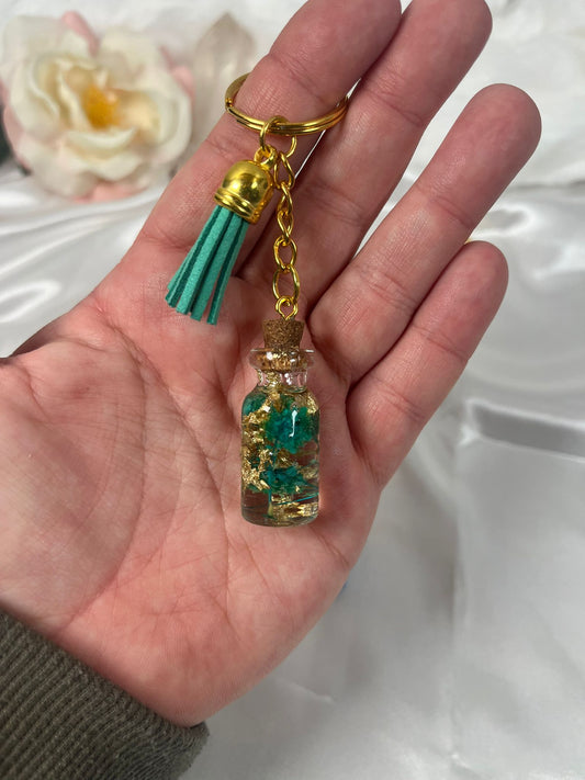 Schlüsselanhänger Blume in der Flasche Gold